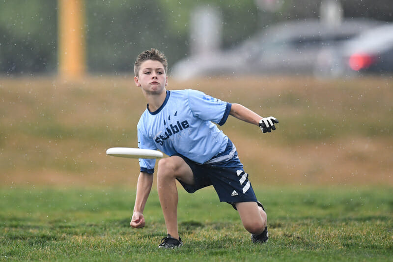 A Stubble player throws a forehand at the USA Ultimate U17 Youth Club Championships of frisbee.