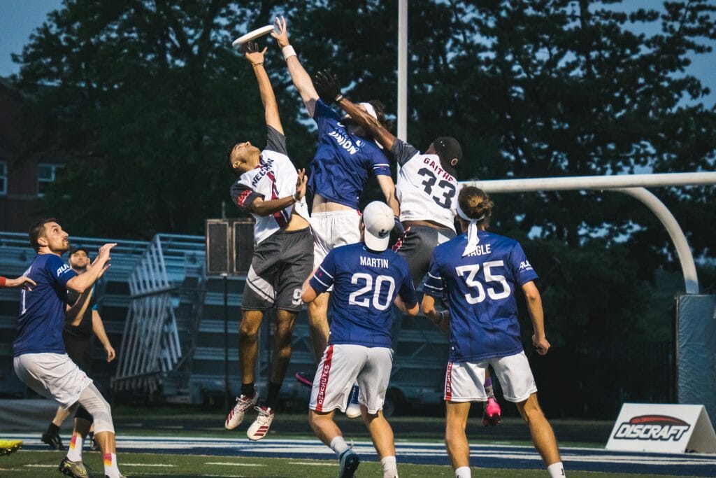 The Chicago Union and Detroit Mechanix go up for a contested jump ball in the 2021 American Ultimate Disc League.