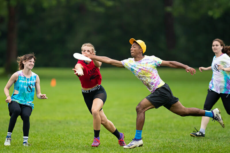 Two players vie for the disc on Sunday in bracket play at the Boston Invitational. Photo: Burt Granofsky -- UltiPhotos.com