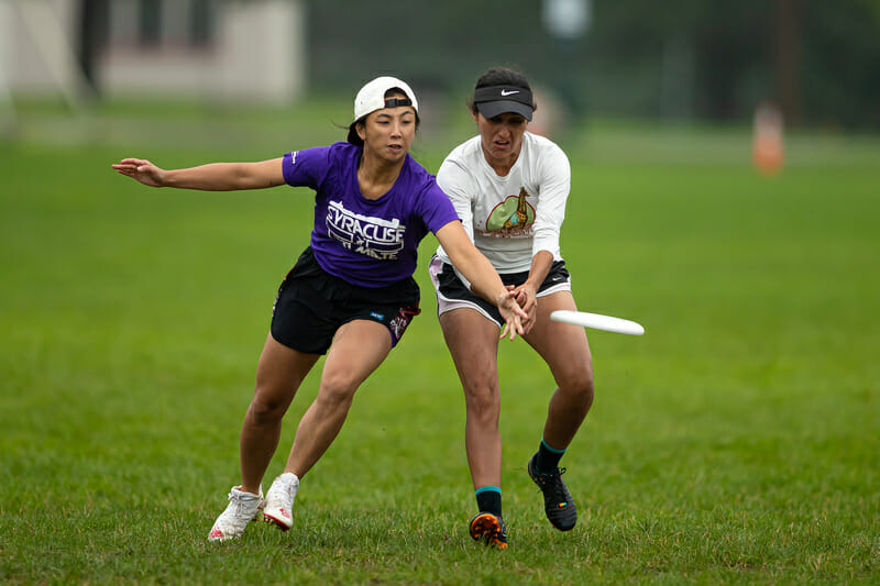 Two players go for for the disc at the Boston Invitational. Photo: Burt Granofsky -- UltiPhotos.com