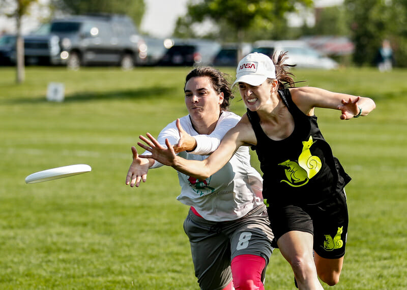 Maryann Platt defensively fights for the disc during pool play at the Masters Championships. Photo: Sandy Canetti -- UltiPhotos.com