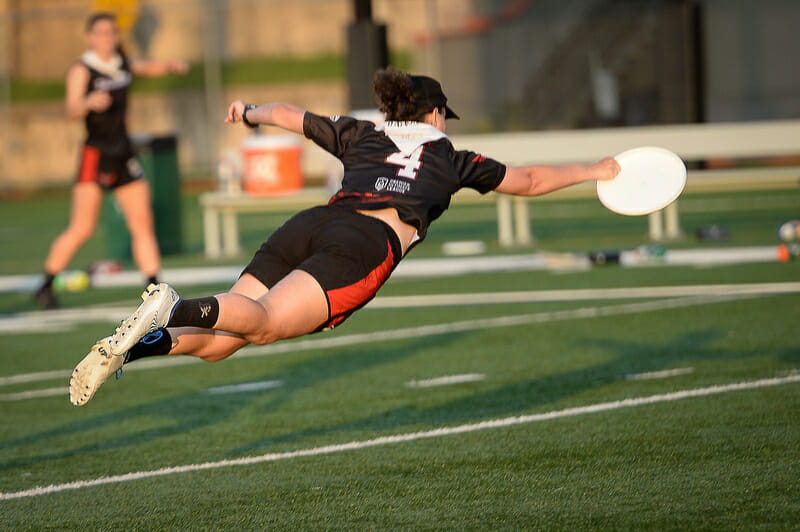 The Radiance's Ashley Powell stabs a diving catch during the Premier Ultimate League's 2021 East Championship Series of women's frisbee.