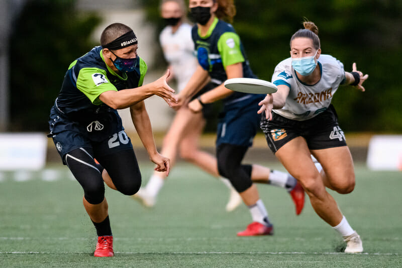 Charlie Eide and Helen Eifert both attack the disc at the WUL Tempest Showcase in Seattle. Photo: Sam Hotaling -- UltiPhotos.com 