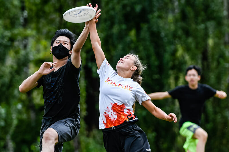 Players go up for the disc at the BCU Junior Club tournament. Photo: Jeff Bell -- Ultiphotos.com