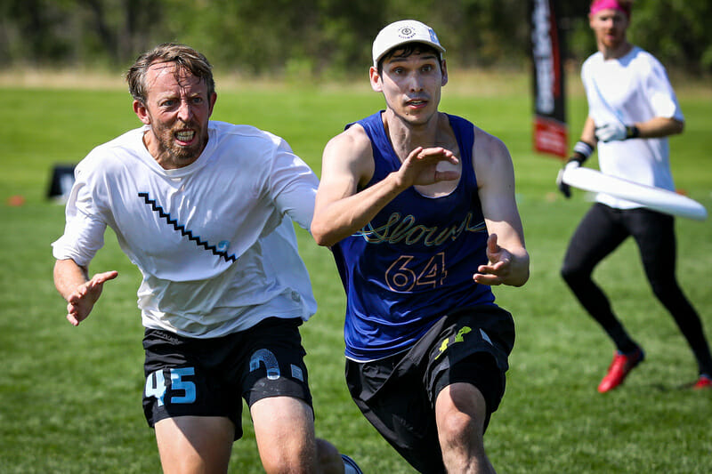 Jamie Quella competes for the disc at the Masters Championships. Photo: Kristina Geddert -- UltiPhotos.com