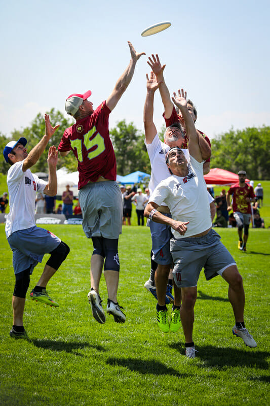 Five players battle for the disc during the finals at the Masters Championships. Photo: Kristina Geddert -- UltiPhotos.com