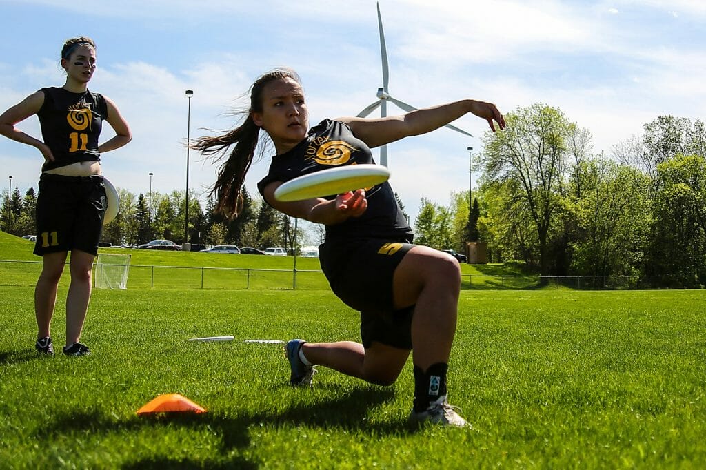 Players for St. Olaf Vortex, the college's women's ultimate frisbee team, prepare for a game. Photo: Alex Fraser -- UltiPhotos.com