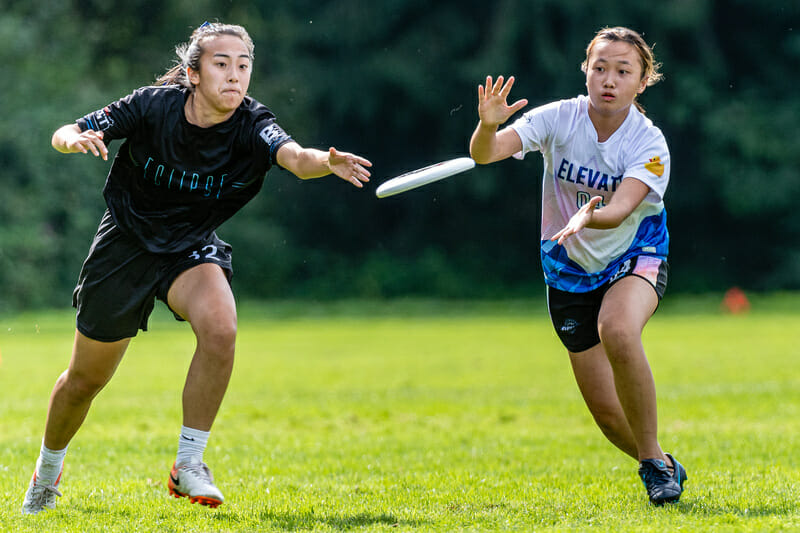 Two players vie for the disc at the British Columbia Junior Ultimate Championships. Photo: Jeff Bell -- UltiPhotos.com