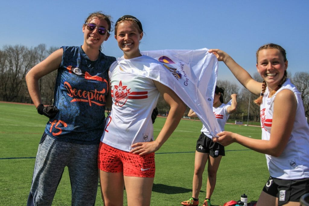 Some players on the sideline from Rutgers University women's college ultimate frisbee club.