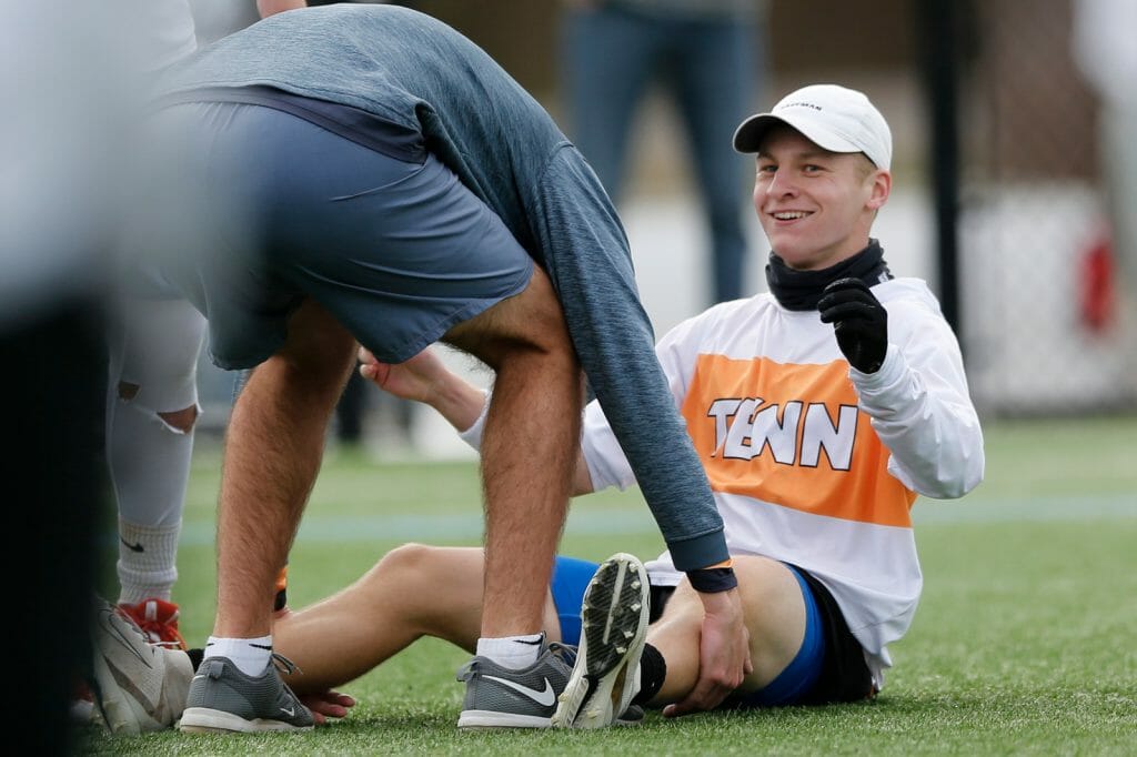 A University of Tennessee college men's ultimate frisbee team member gestures from the ground during a match. Photo: William "Brody" Brotman -- UltiPhotos.com