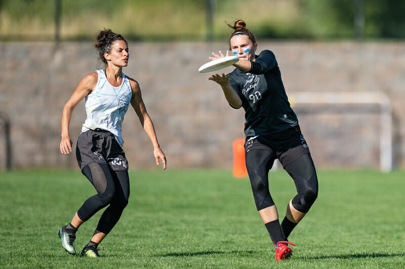 Qxhna Titcomb of Seattle Mixtape catches past Sarah Benditt of Seattle BFG during mixed semifinals at the 2021 Pro Championships. Photo: Sam Hotaling -- UltiPhotos.com