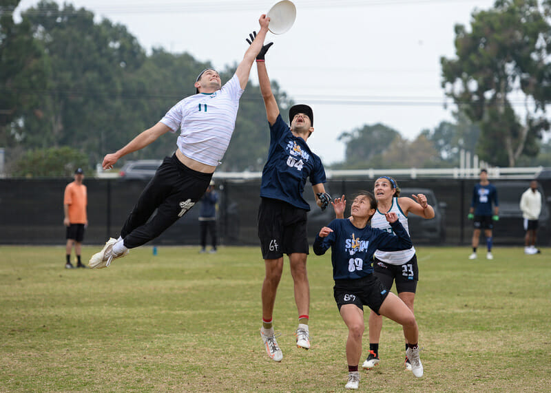 Jordan Rhyne of Philadelphia AMP makes an impressive skying grab against Boston Slow in the 2021 Club Championships prequarters. Photo: Kevin Leclaire -- UltiPhotos.com