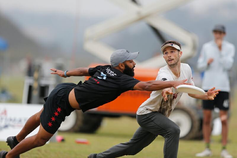 Chicago Machine's Johnny Bansfield gets a layout point block on double game point in a prequarter against San Francisco Revolver at the 2021 Club Championships. Photo: William 'Brody' Brotman -- UltiPhotos.com