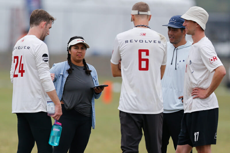 San Francisco Revolver coaches Molica Anderson and Cody Mills huddle with team leadership. Photo: William 'Brody' Brotman -- UltiPhotos.com