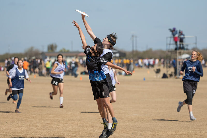 Carleton's Mia Beeman-Weber goes over UC San Diego's Ava Hanna at the 2022 Stanford Invite.