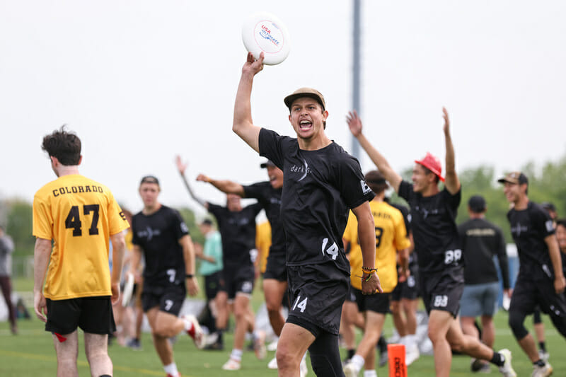 Bodhi Harmony of North Carolina celebrates in the semifinal of the 2022 D-I College Championships. Photo: Paul Rutherford -- UltiPhotos.com