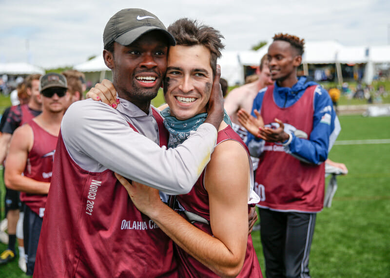 Oklahoma Christian's Emmanuel Bilolo and Elliott Moore celebrate winning the 2022 D-III College Championships. Photo: William 'Brody' Brotman -- UltiPhotos.com