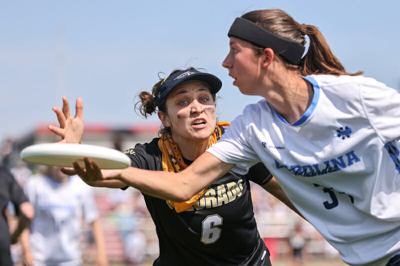UNC's Alex Barnett looks for a throw past Colorado's Emma Capra in the 2022 D-I College Championships final.