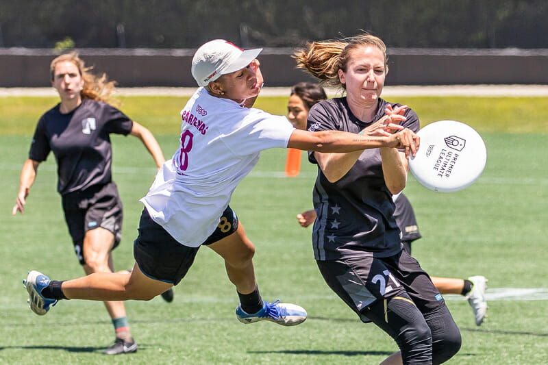 Medellin Revolution Pro's Manuela Cardenas with a defensive takeaway in the final of the 2022 Premier Ultimate League's frisbee Championship Weekend.