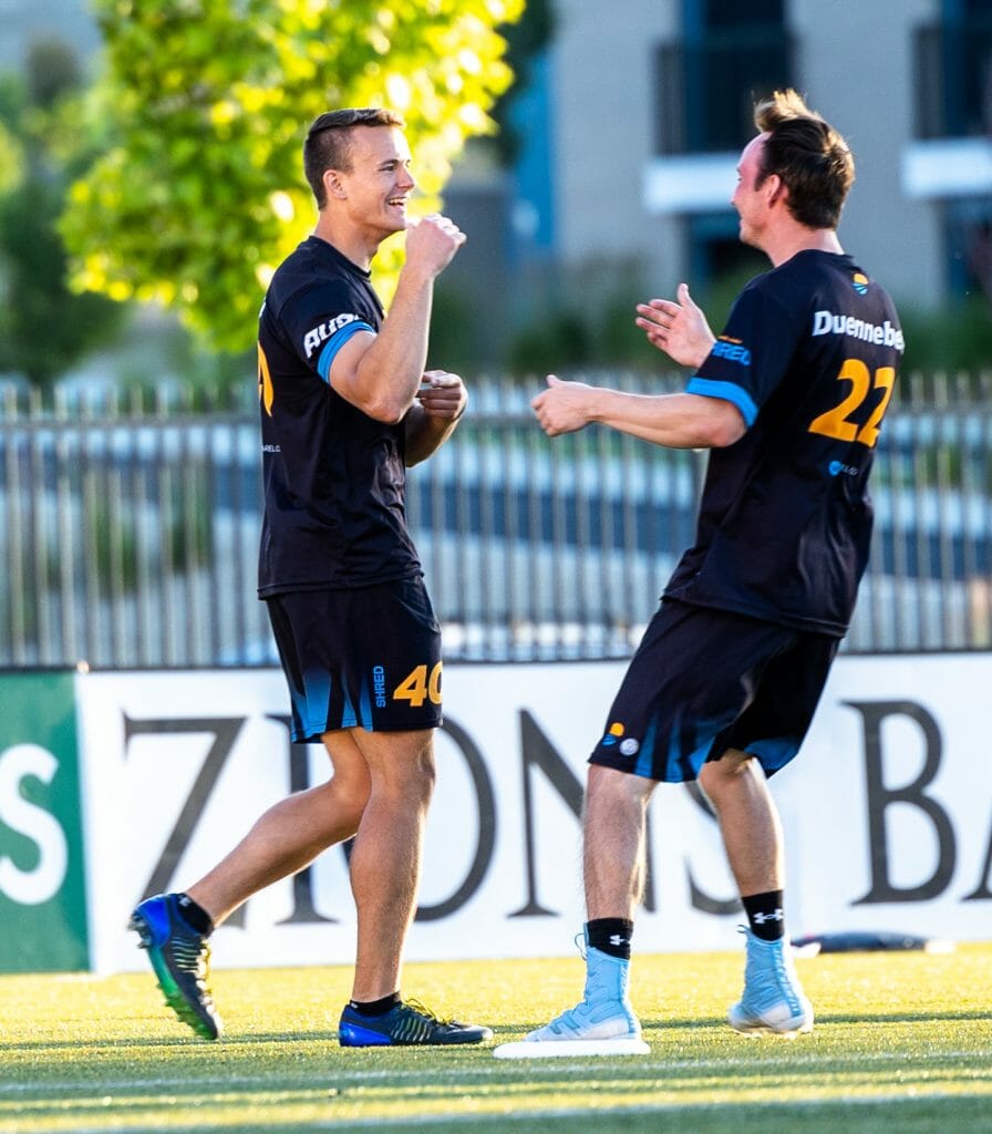 Salt Lake Shred celebrate a score during a 2022 American Ultimate Disc League regular season frisbee match.