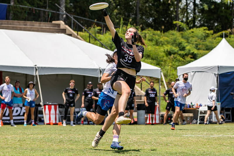 Canada's Michal Lewis rises up for the catch against Great Britain at the 2022 World Games. Photo: Katie Cooper -- UltiPhotos.com