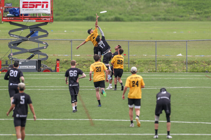 Colorado's Alex Atkins goes up for the disc in their semifinal the 2022 D-I College Championships.