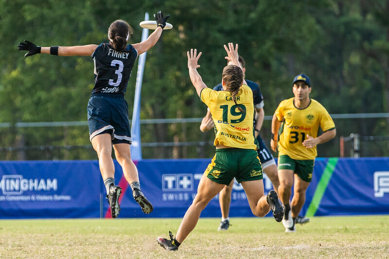 United States' Carolyn Finney gets to a disc ahead of Australia's Olivia Carr in the gold medal match for ultimate frisbee, or Flying Disc, at the 2022 World Games.
