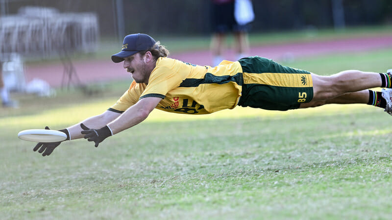 Australia's Tom Tulett hits the dirt for a catch in the semifinals at the 2022 World Games.