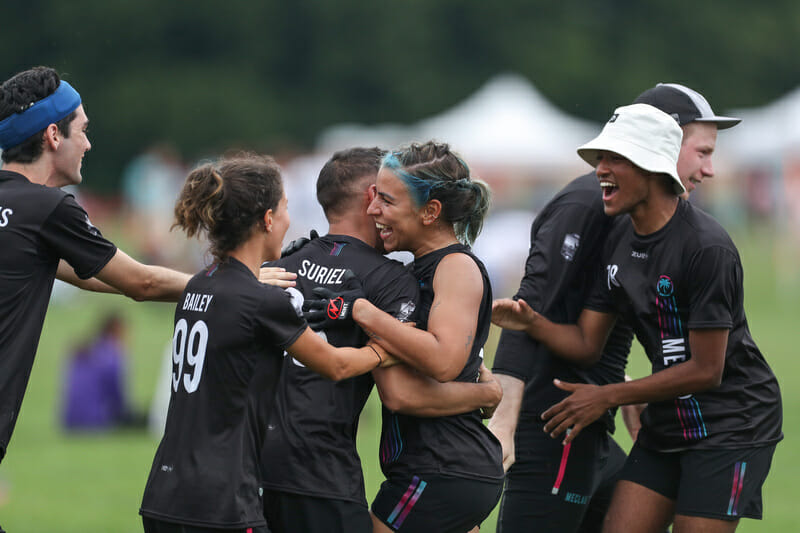 Meclao celebrate their upset victory over BFG at WUCC. Photo: Paul Rutherford -- UltiPhotos.com