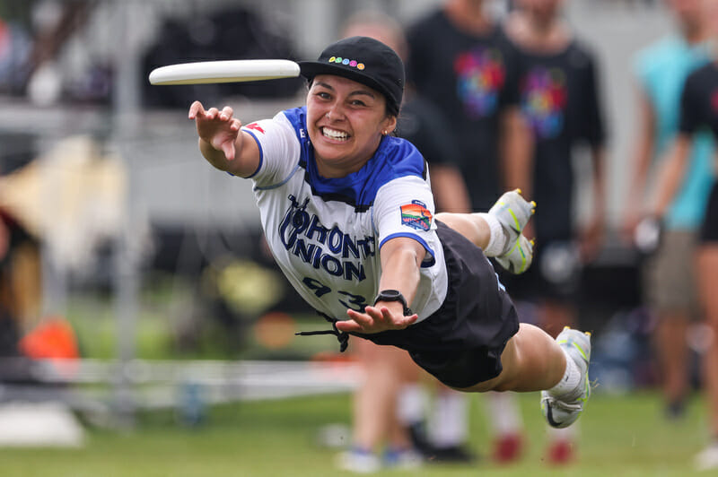 Toronto UNION's Naomi Redmond makes a big bid at WUCC 2022. Photo: Paul Rutherford -- UltiPhotos.com