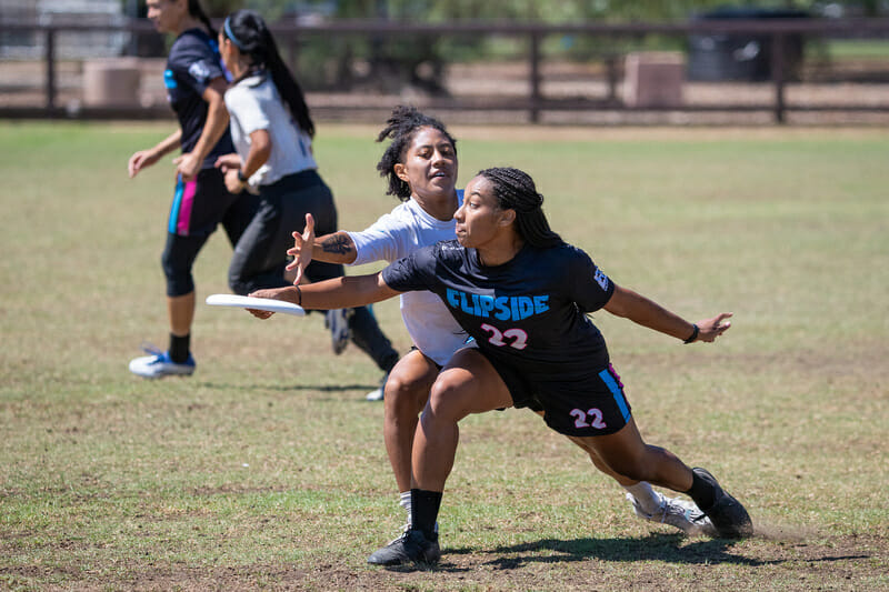 Flipside's Camille Wilson throws past Fury's Opi Payne. Photo: Rodney Chen -- UltiPhotos.com