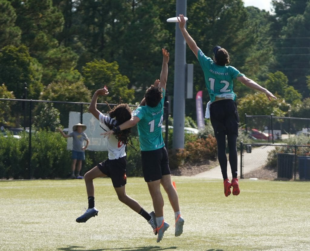 Washington DC Truck Stop's Rowan McDonnell leaps for a disc against Raleigh Ring of Fire at the 2022 Pro Championships.