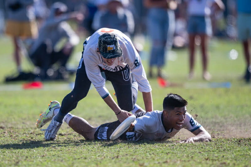 Rhino Slam's Itay Chang makes the winning catch in the quarterfinals at the 2022 Club National Championships. Photo: Sam Hotaling -- UltiPhotos.com