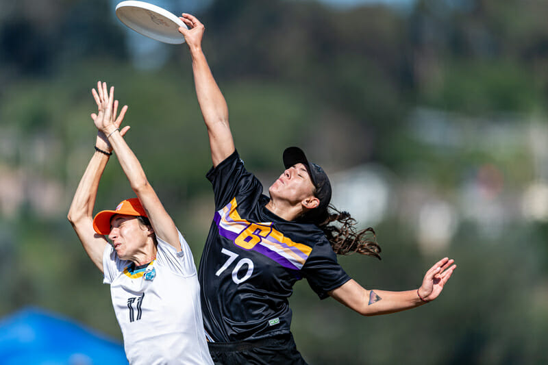 Britteny Dos Santos goes up and over Portland Schwa for a catch in the quarterfinals at the 2022 Club National Championships. Photo: Jeff Bell -- UltiPhotos.com