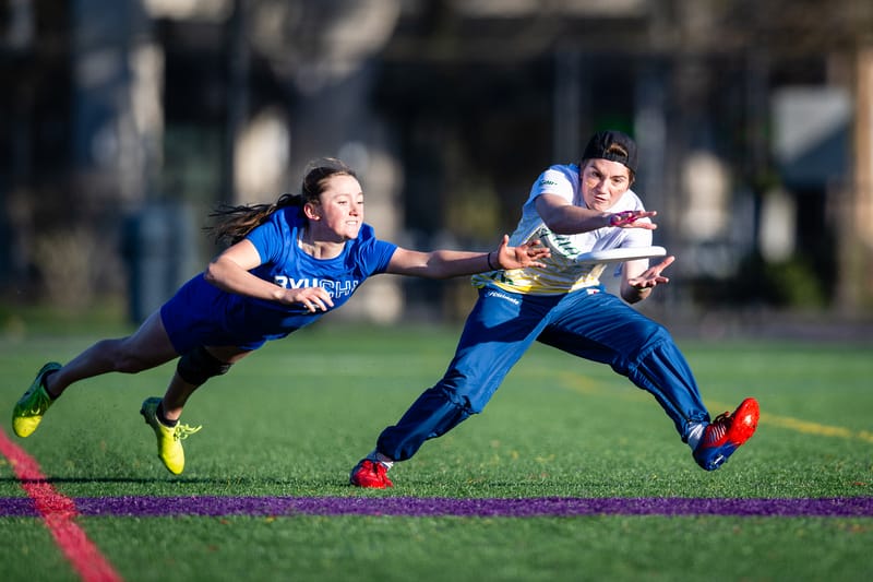 Oregon's Ezra Weybright makes the catch past a bidding Brigham Young defender at the ultimate frisbee tournament Northwest Challenge 2024. Photo: Sam Hotaling - UltiPhotos.com
