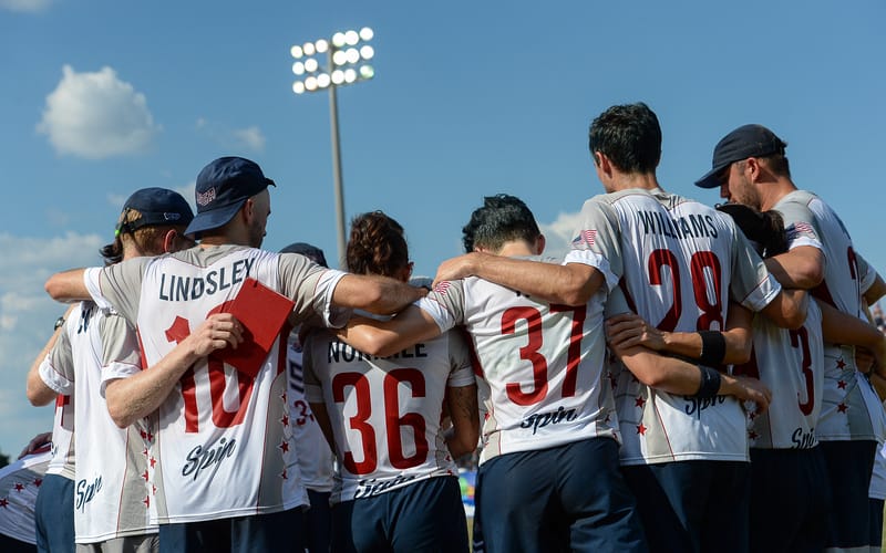 Team USA huddle during the 2022 World Games ultimate frisbee semifinal. Photo: Kevin Leclaire - UltiPhotos.com
