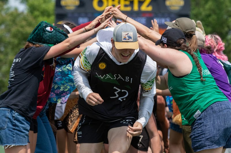 The Colorado College women's division team forms a tunnel for the Colorado College men's division team after they won the 2023 D-III Ultimate Frisbee College Championships. Photo: Kevin Wayner - UltiPhotos.com