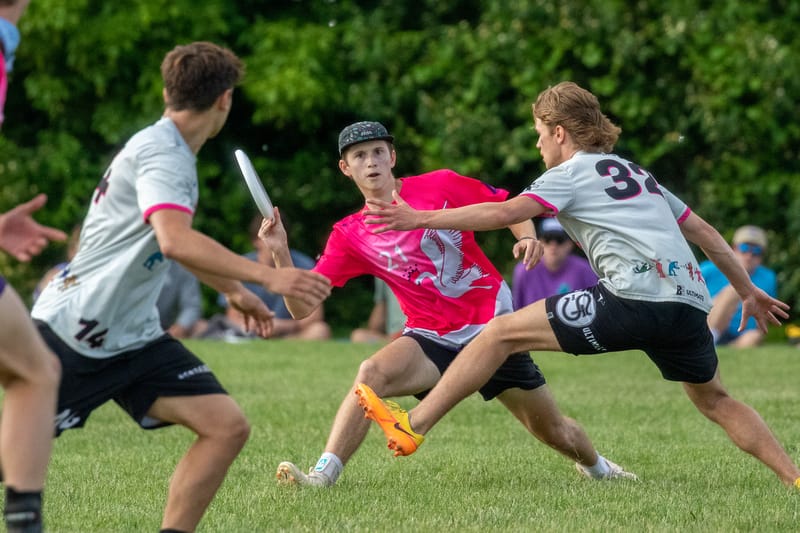 Middlebury's JohnSavage throws past the St. Olaf mark in the semifinals of the 2023 D-III men's ultimate frisbee College Championships. Photo: Kevin Wayner - UltiPhotos.com