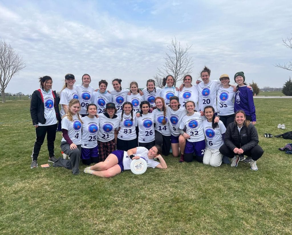 The Macalester Pursesnatchers pose for a team photo after breaking seed at the 2024 women's ultimate frisbee tournament, the Old Capitol Open. Photo: Macalester - @pursesnatchers_ultimate