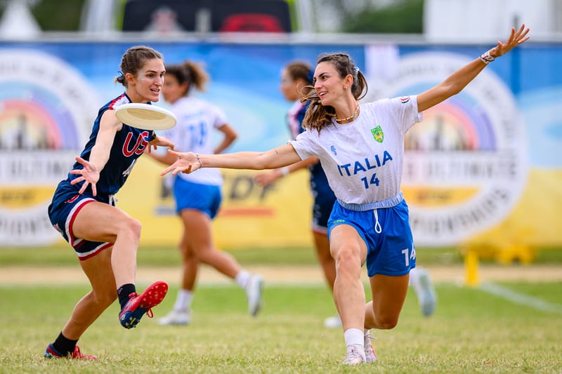 Italy Mixed's Nicole Lafiata throws an around backhand past the US mark at the 2024 World Ultimate Frisbee Championships. Photo: Sam Hotaling - UltiPhotos.com