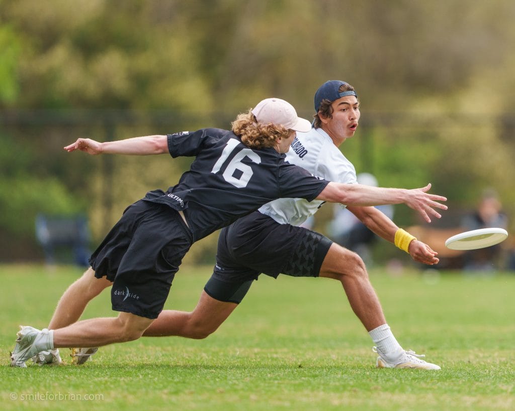 Colorado's Tobias Brooks throws a backhand past the North Carolina mark during the semifinal of Easterns 2025. Photo: Brian Whittier