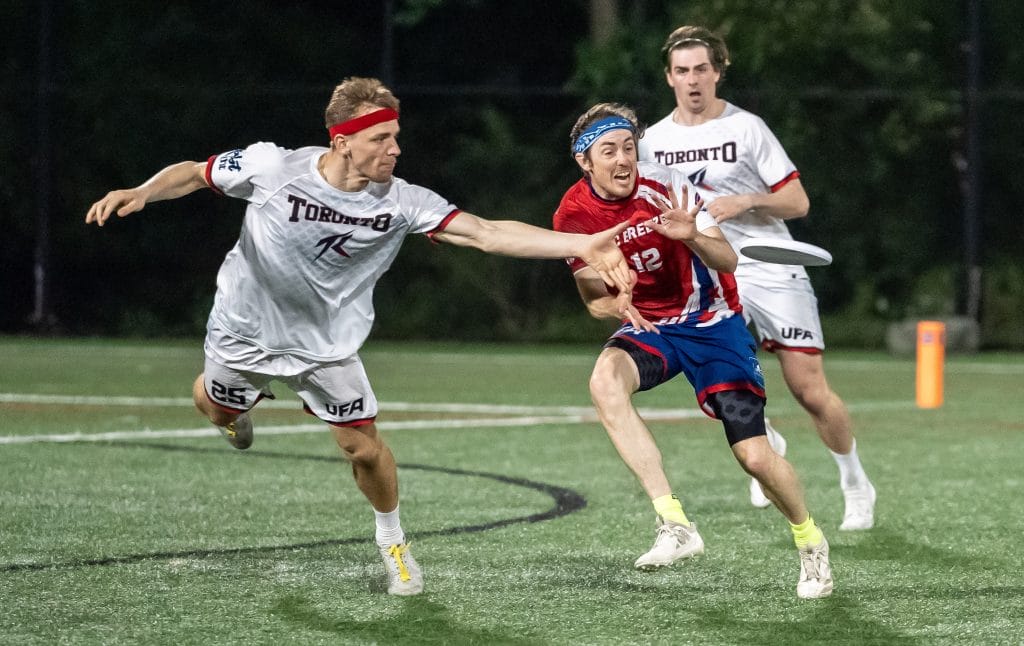 Toronto's Toms Abeltins gets the layout block on DC's Rowan McDonnell during the 2025 UFA regular season. Photo: Alan Bloodgood - UFA