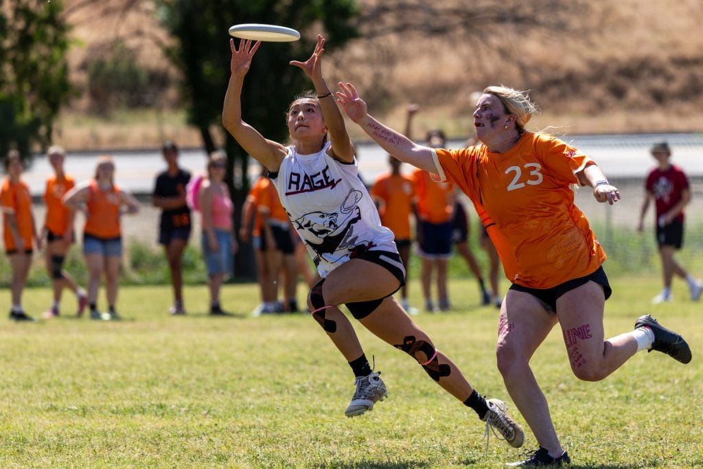 Santa Clara RAGE secure the disc past an Occidental defender at 2026 Southwest Conferences. Photo: Marybeth Vellequette - UltiPhotos.com